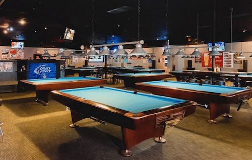 Bar full of Pool Tables